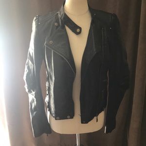 Black faux leather jacket with snaps and zippers